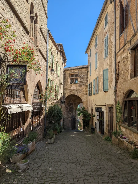 A beautiful alleyway between shops in the medieval town of Cordes-sur-Ciel, France