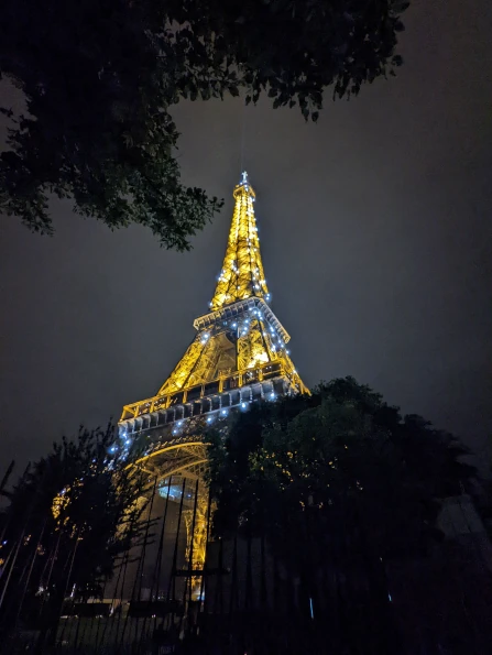 A night shot of the Eiffel Tower during the sparkly light show that happens every 30 minutes.
