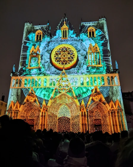 The Fete des Lumieres (Festival of Lights) light show in Lyon, France projecting a kaleidoscope design onto an old cathedral