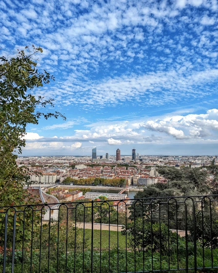 On a hike looking down on the skyline of Lyon, France on a beautiful sunny day